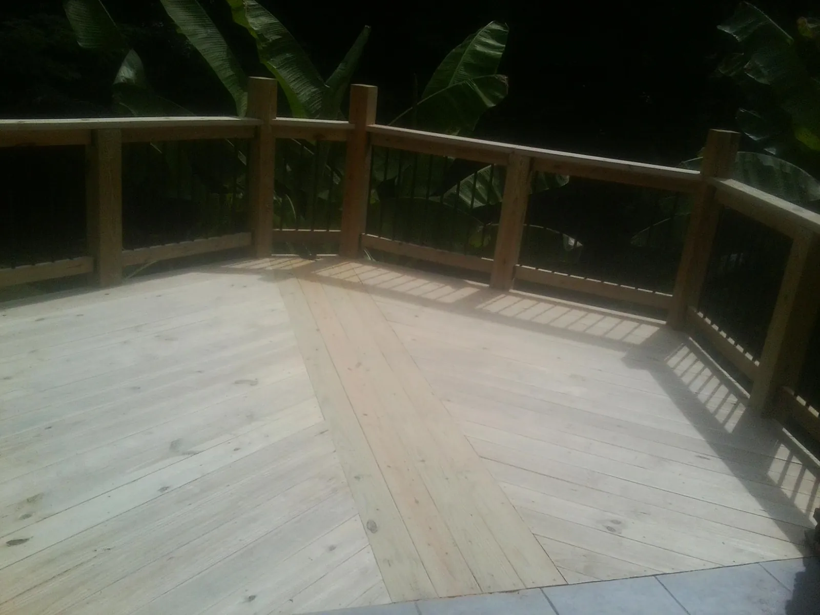 New wood deck and railing built off the back of a home in Cheyenne